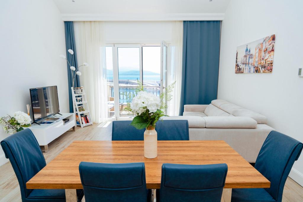 Bright living and dining room opening onto the sea