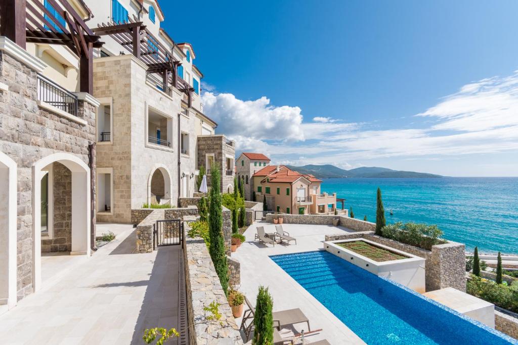 Stone village pools above the open Adriatic